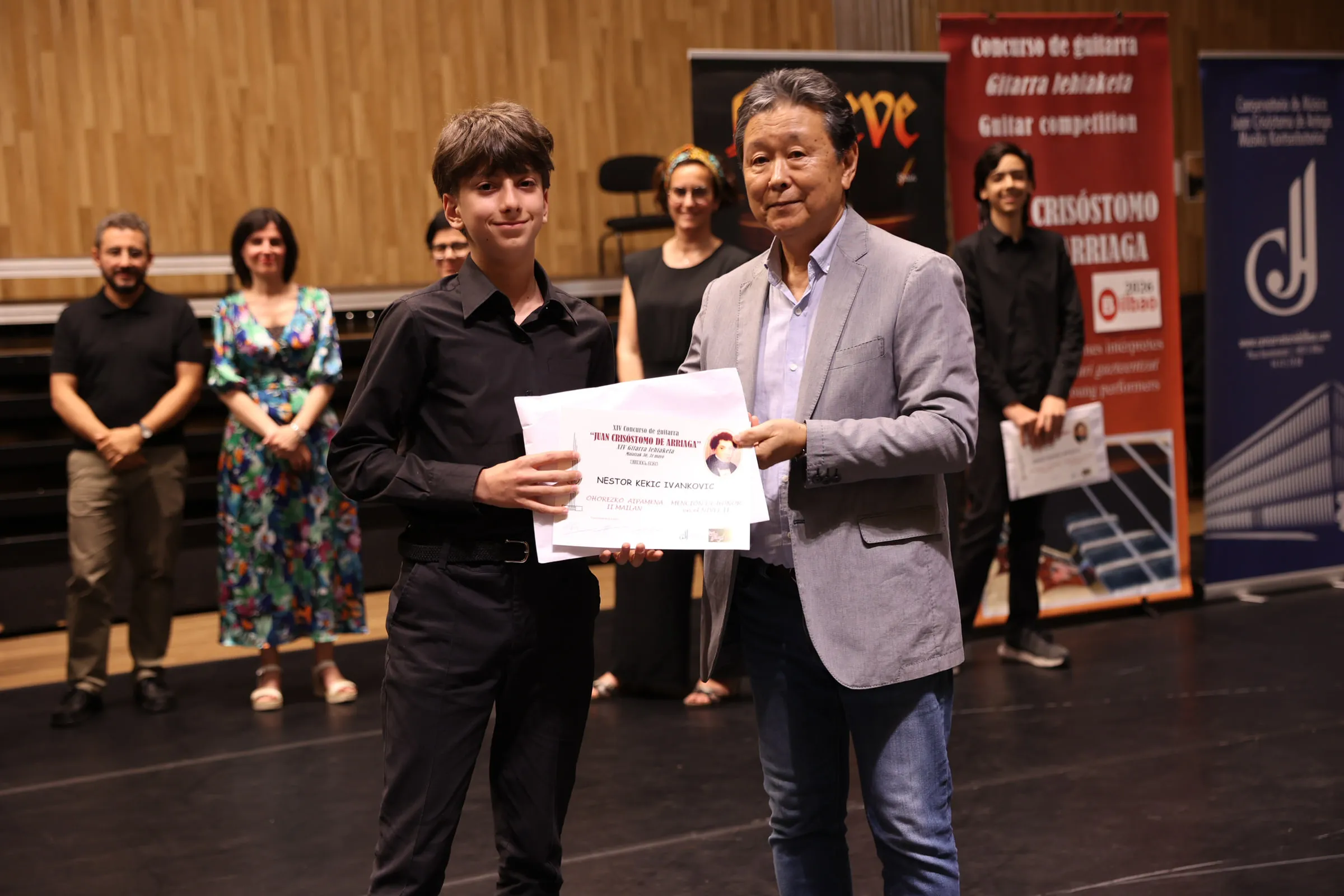 Nestor receiving his Mención de Honor at the XIV Concurso «Juan Crisóstomo de Arriaga».