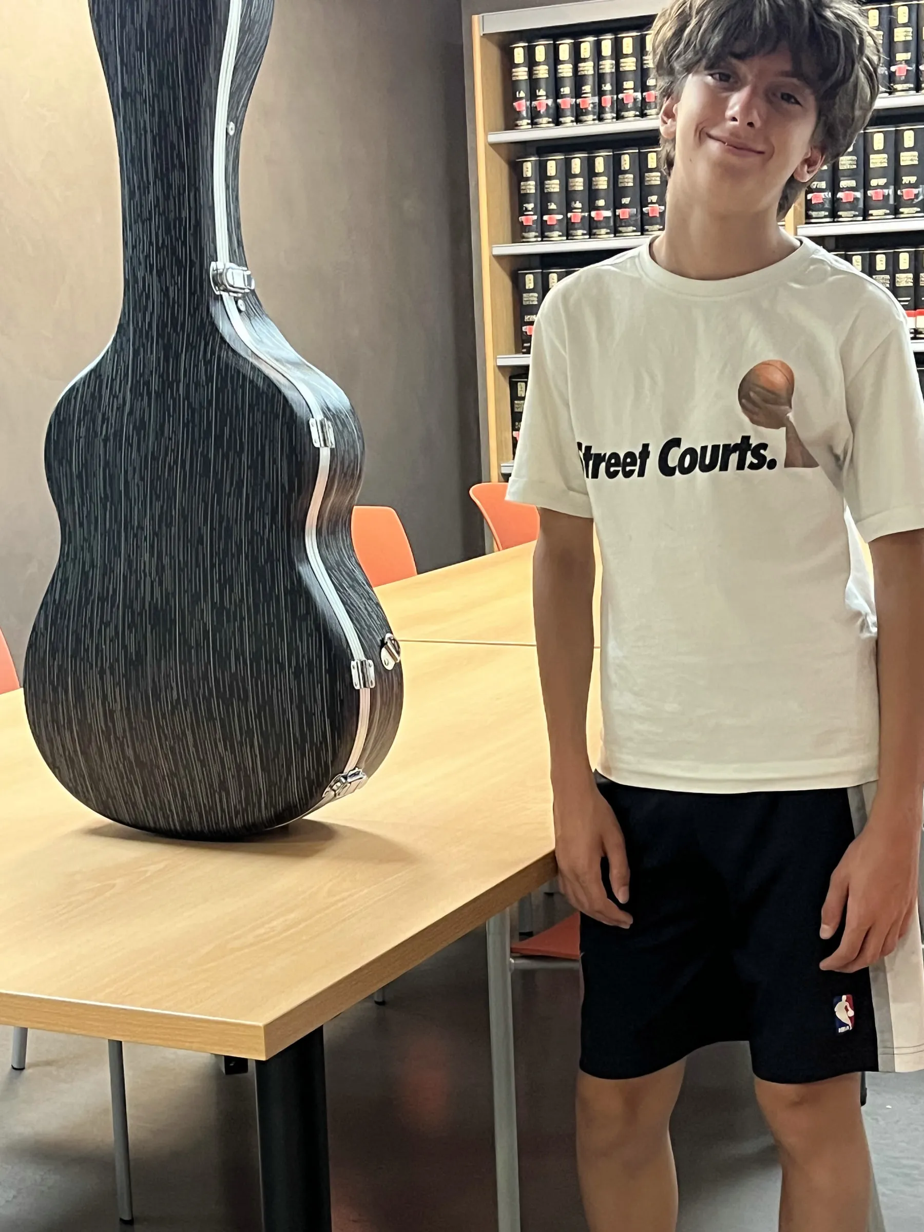 Nestor with his guitar case in the festival’s teaching rooms.