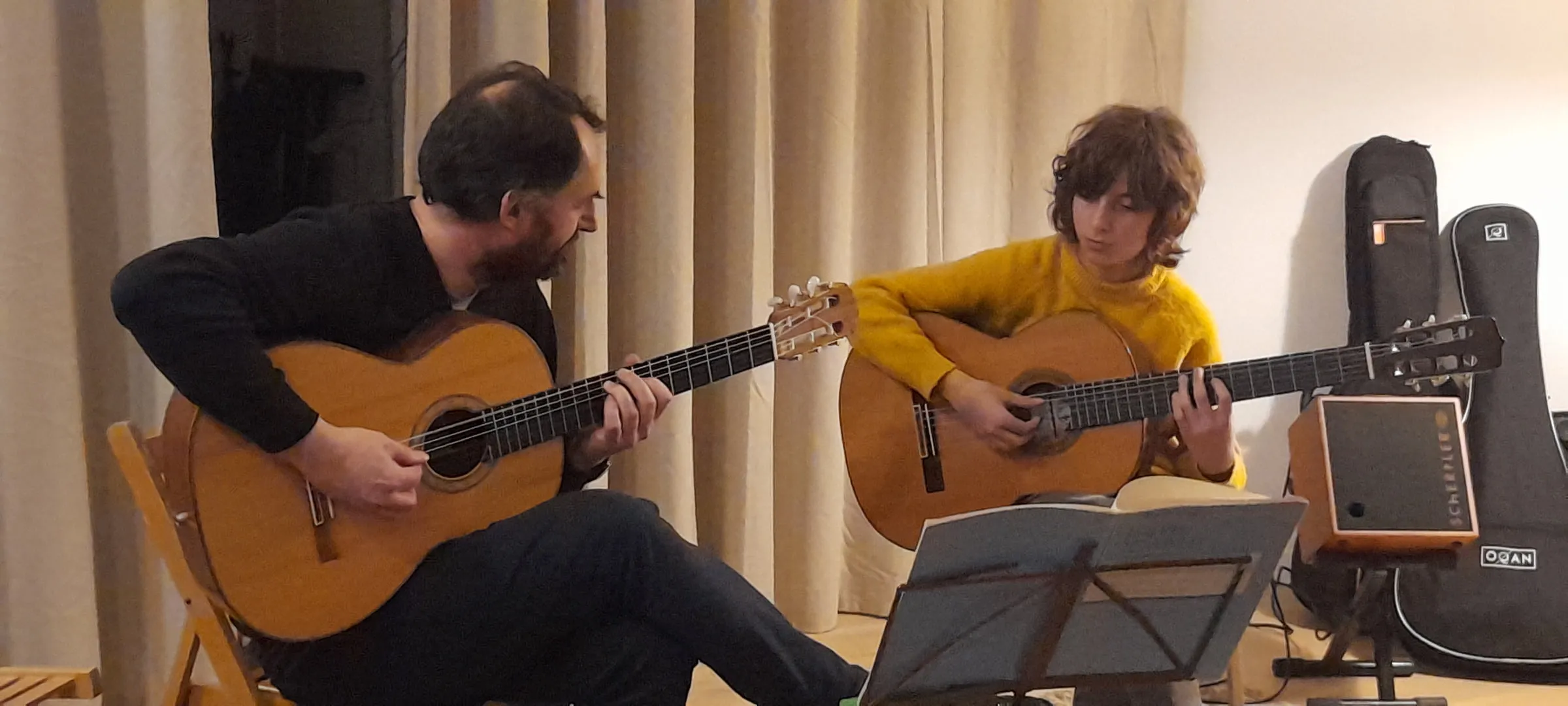 Nestor playing alongside his teacher.